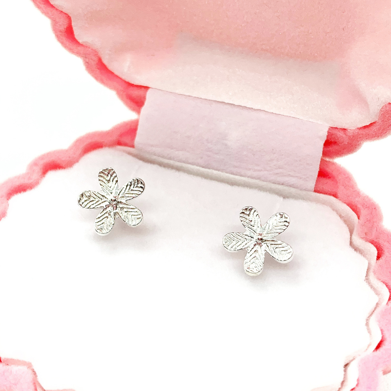 flower stud earrings in box close up
