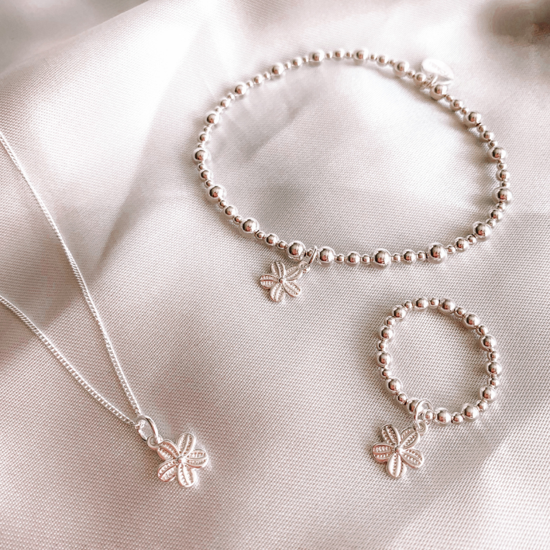 Load image into Gallery viewer, Dainty Flower Charm Bracelet with matching ring and necklace

